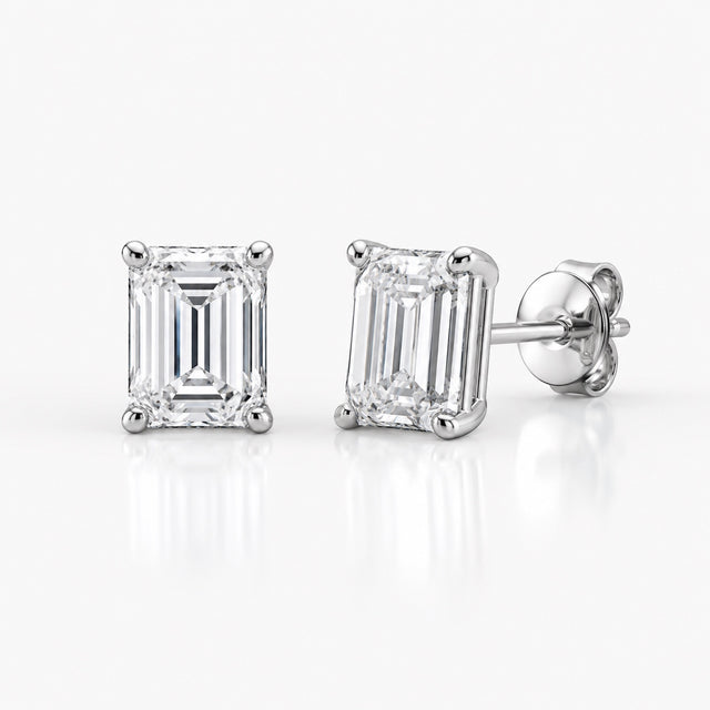 Emerald-cut 1.00 CTW lab-grown diamond stud earrings in 14K white gold, front and side views