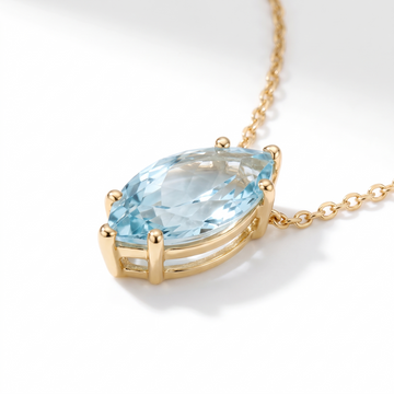 Marquise-cut aquamarine solitaire necklace, gemstone and setting detail — AI-generated design representation