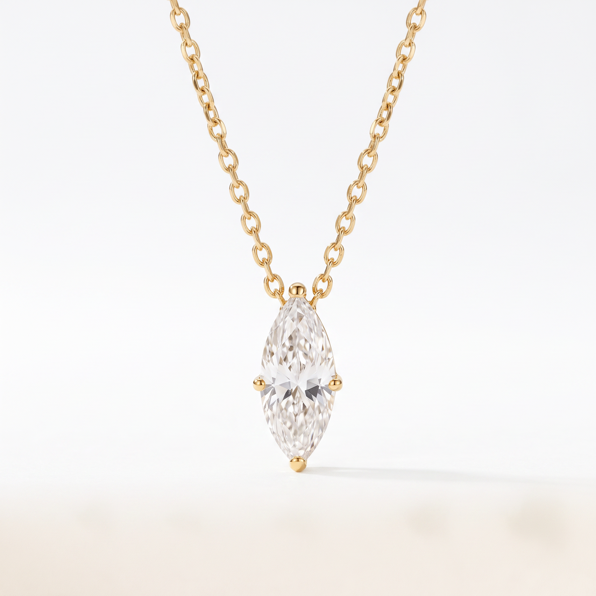 Marquise-cut diamond solitaire necklace in solid gold, catalog view — AI-generated design representation