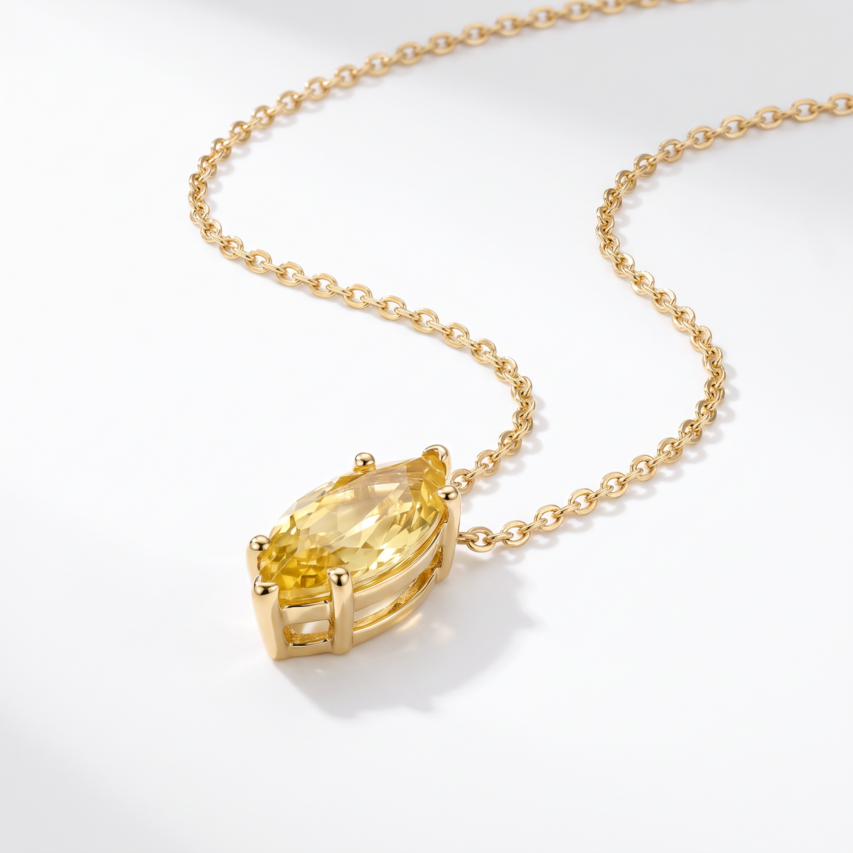 Marquise-cut yellow sapphire solitaire necklace in solid gold, catalog view — AI-generated design representation