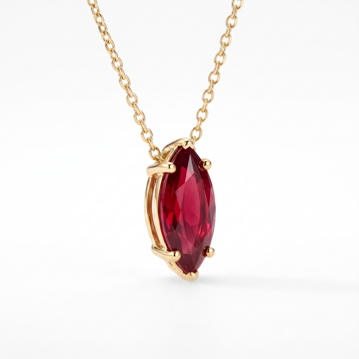 Marquise-cut ruby solitaire necklace, angled front detail — AI-generated design representation