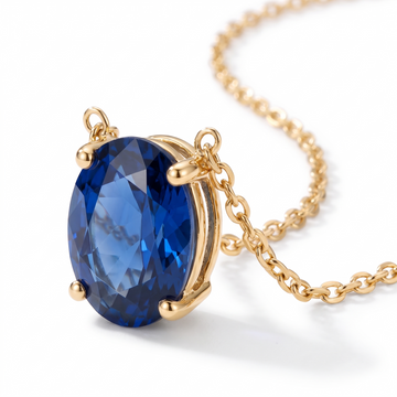 Oval-cut blue sapphire solitaire necklace, gemstone and setting detail — AI-generated design representation
