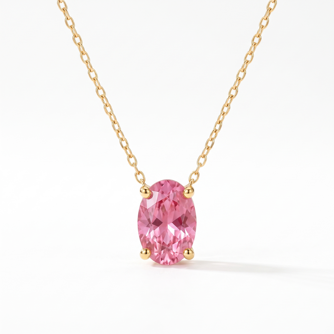 Oval-cut pink tourmaline solitaire necklace in solid gold, catalog view — AI-generated design representation