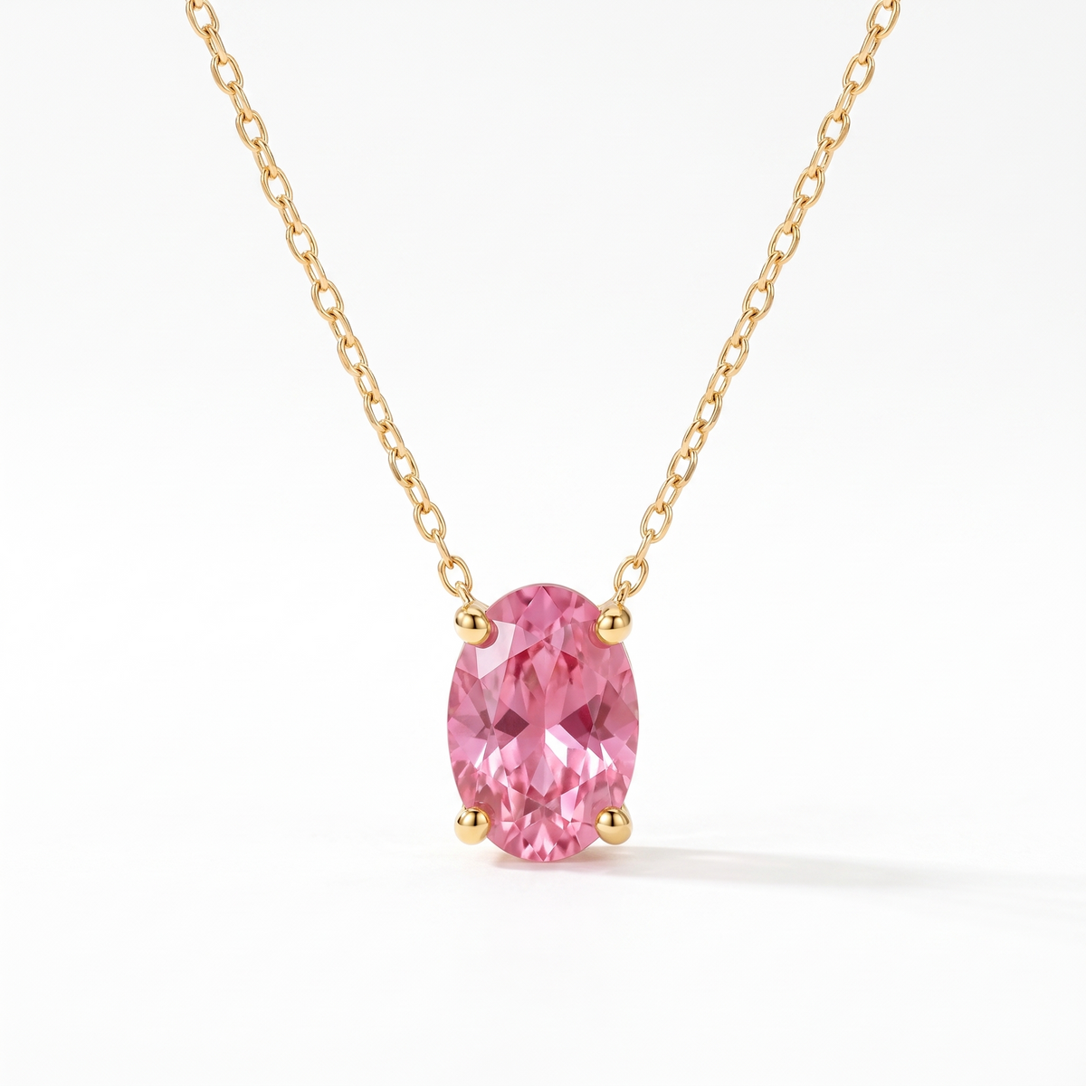 Oval-cut pink tourmaline solitaire necklace in solid gold, catalog view — AI-generated design representation