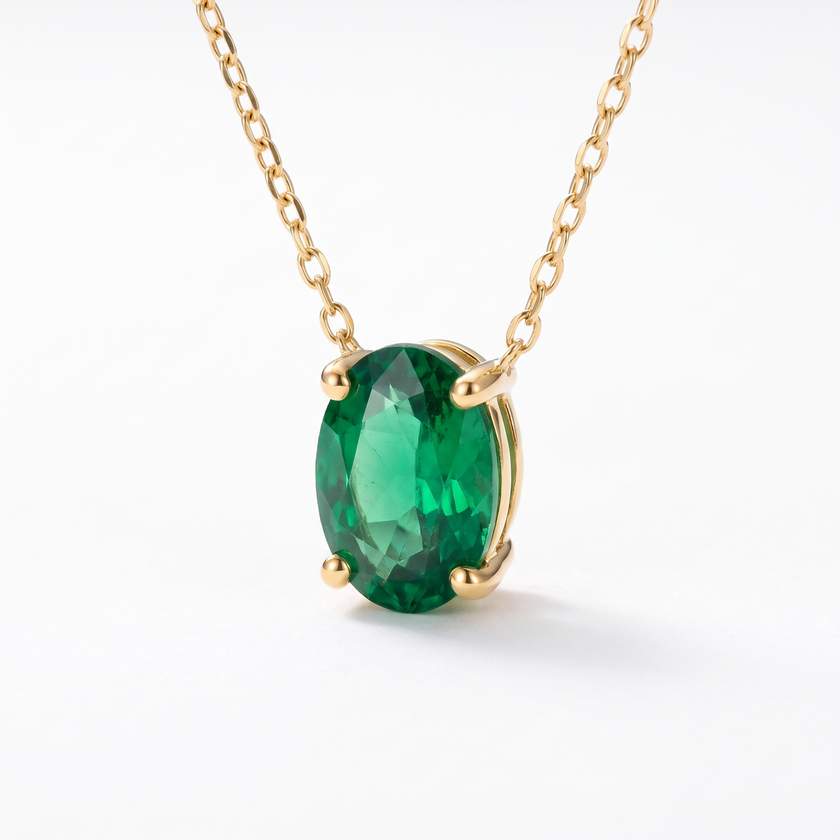 Oval-cut emerald solitaire necklace, angled front detail — AI-generated design representation