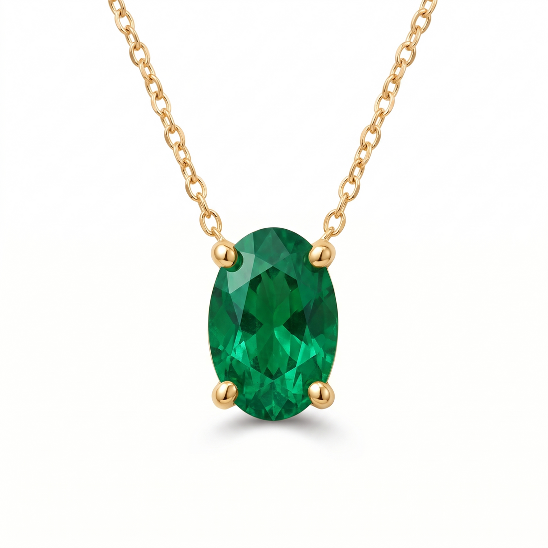 Oval-cut emerald solitaire necklace in solid gold, catalog view — AI-generated design representation
