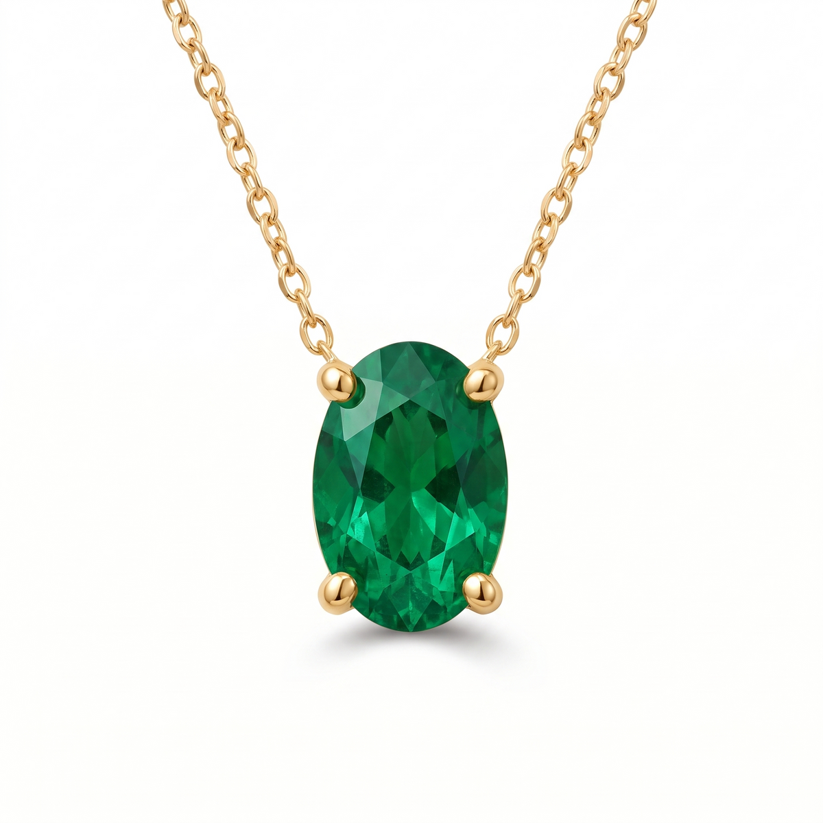 Oval-cut emerald solitaire necklace in solid gold, catalog view — AI-generated design representation