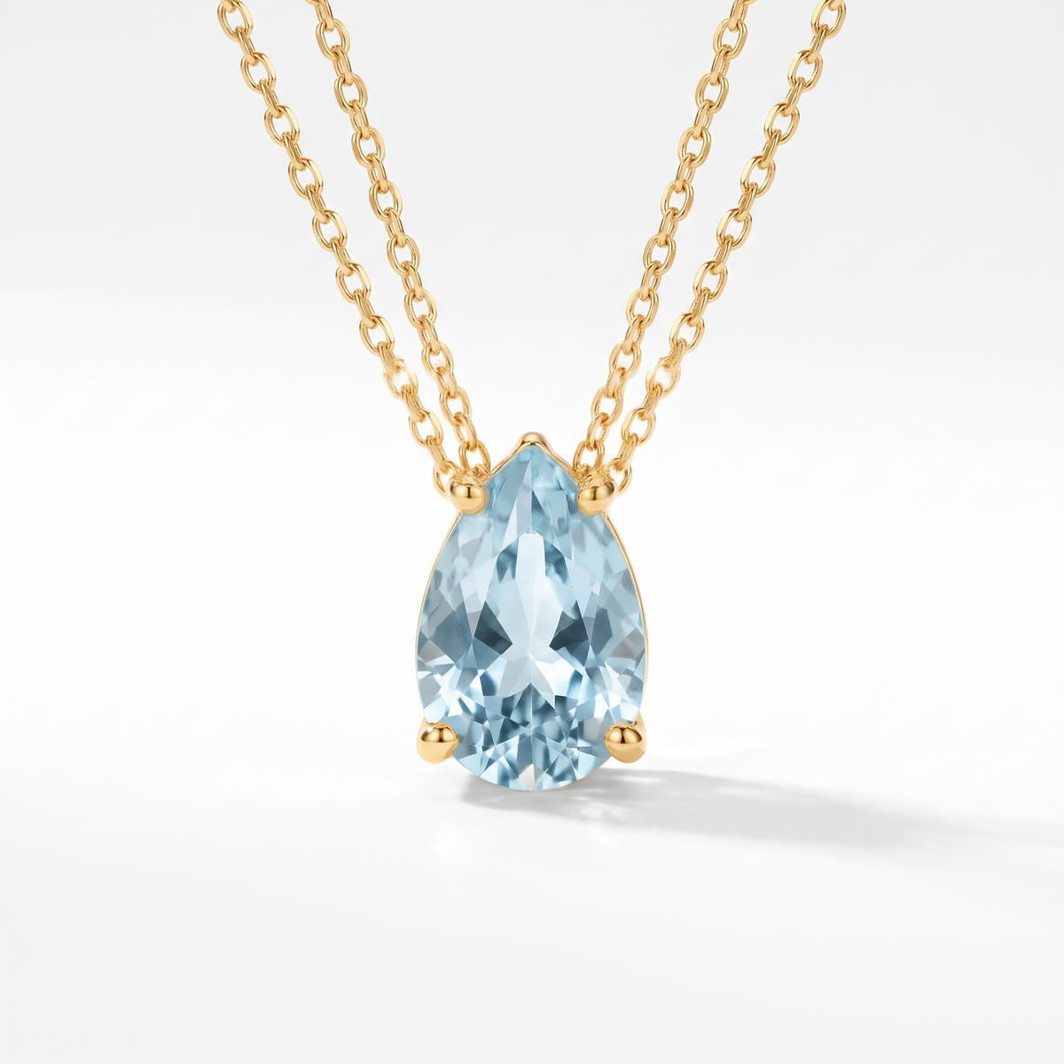Pear-cut aquamarine solitaire necklace in solid gold, catalog view — AI-generated design representation
