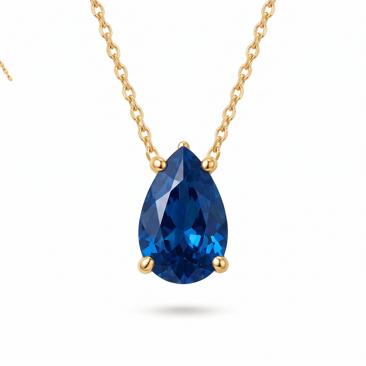 Pear-cut blue sapphire solitaire necklace, angled front detail — AI-generated design representation