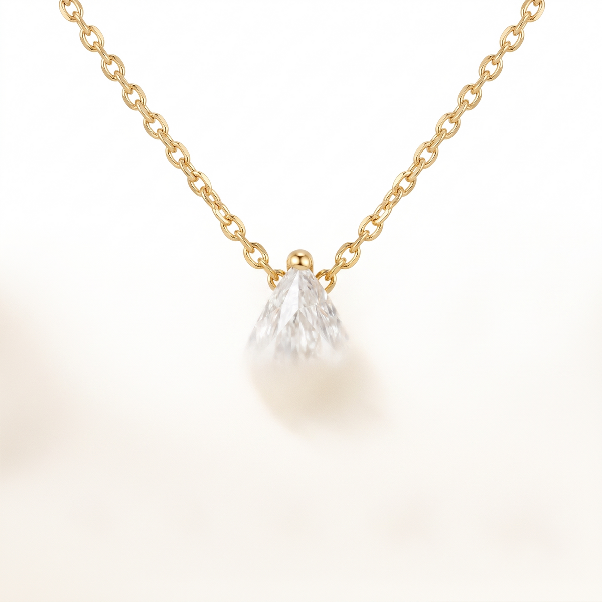 Pear-cut diamond solitaire necklace, angled front detail — AI-generated design representation