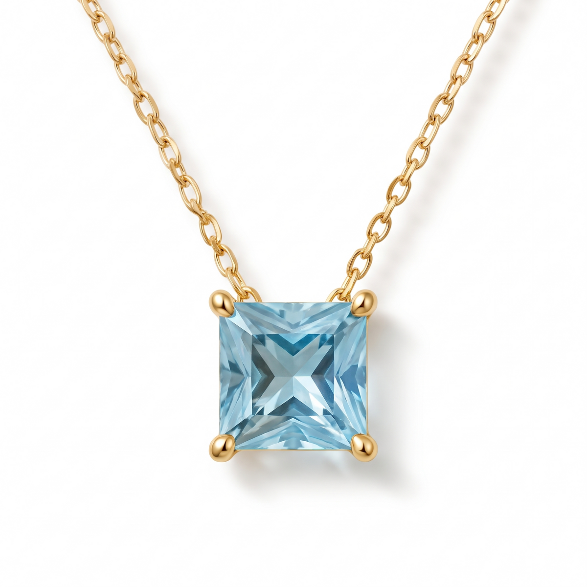 Princess-cut aquamarine solitaire necklace in solid gold, catalog view — AI-generated design representation
