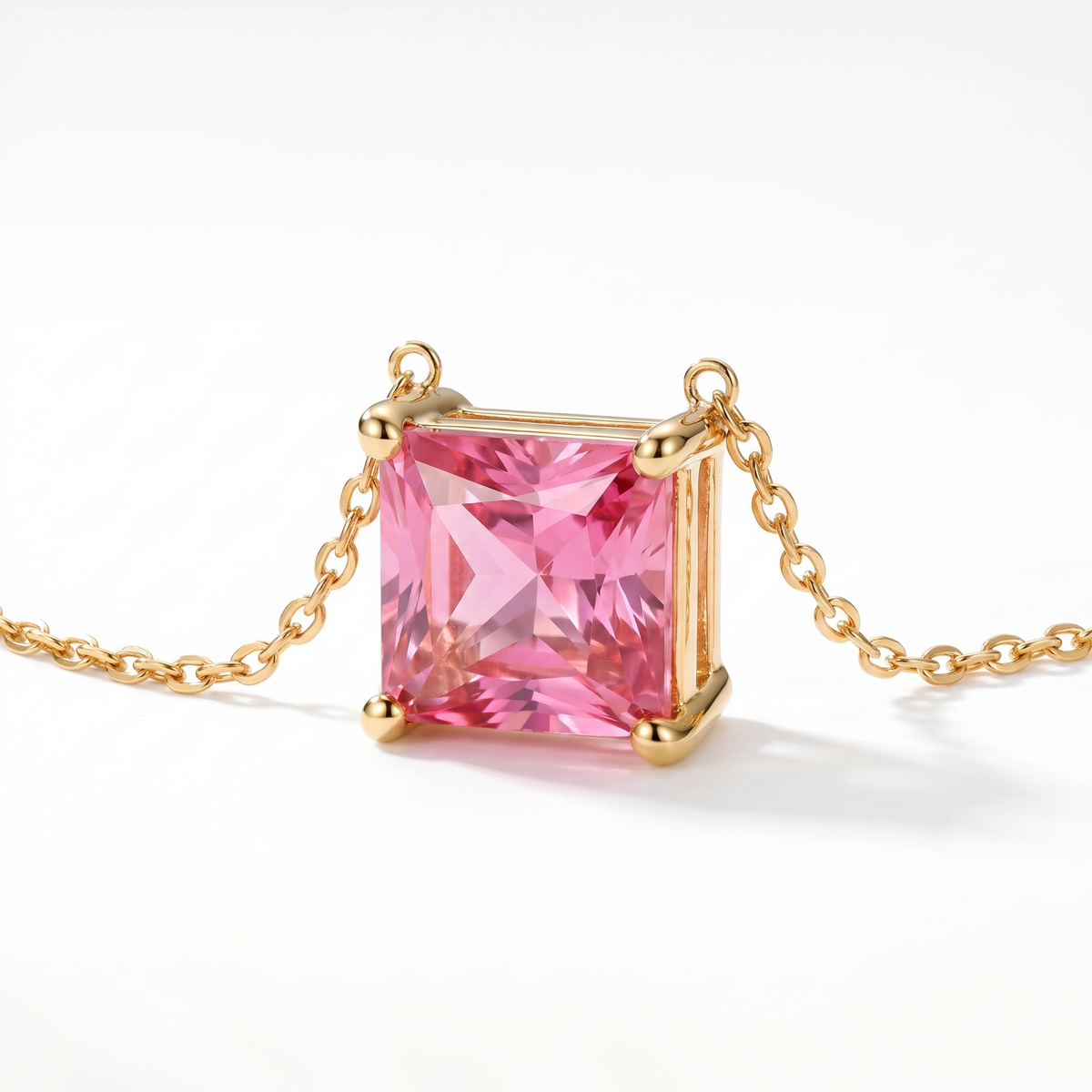 Princess-cut pink tourmaline solitaire necklace, angled front detail — AI-generated design representation