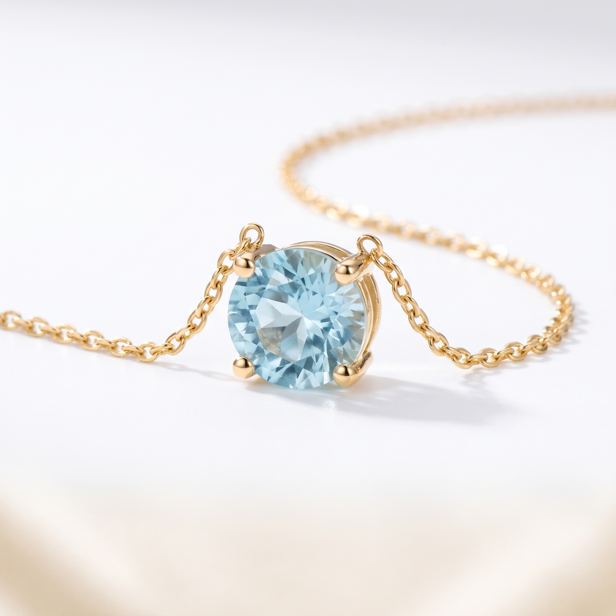Round-cut aquamarine solitaire necklace, angled front detail — AI-generated design representation