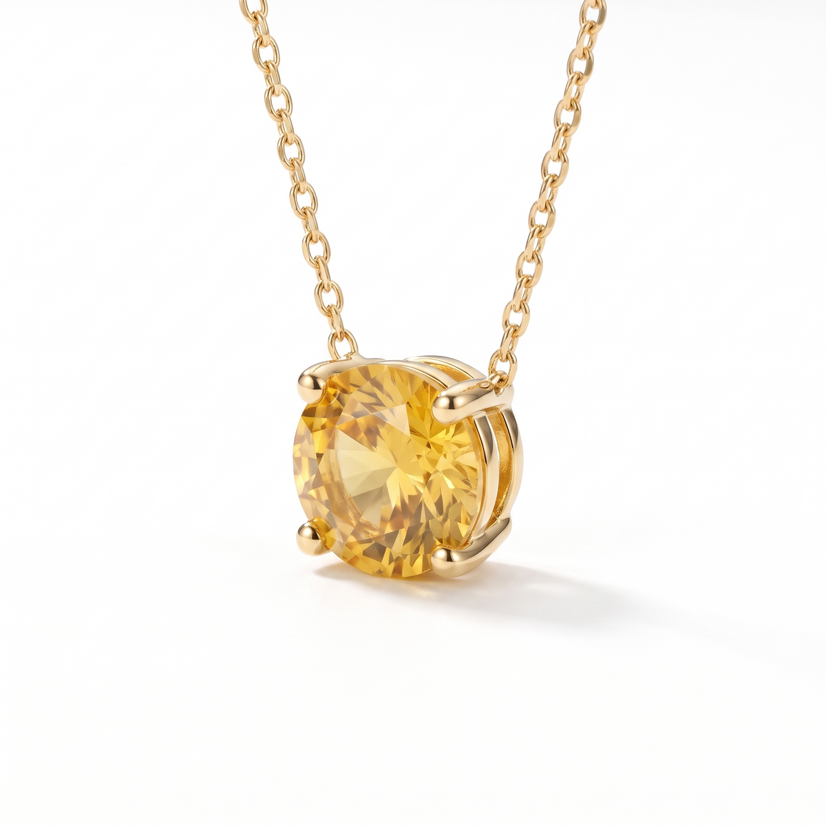 Round-cut yellow sapphire solitaire necklace, angled front detail — AI-generated design representation