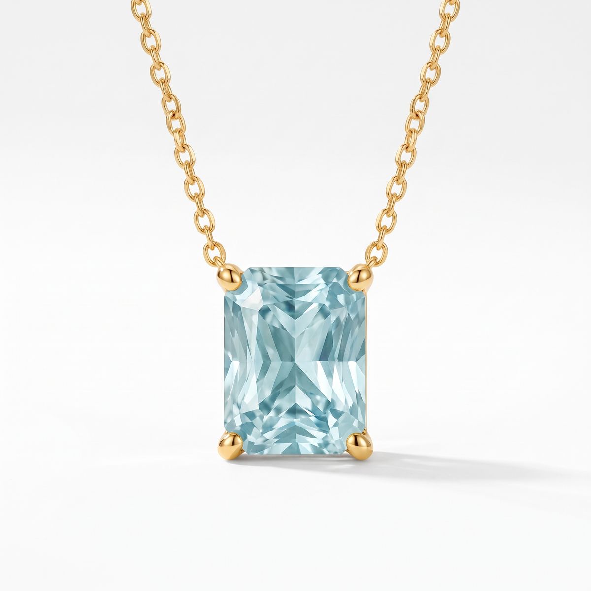Radiant-cut aquamarine solitaire necklace in solid gold, catalog view — AI-generated design representation