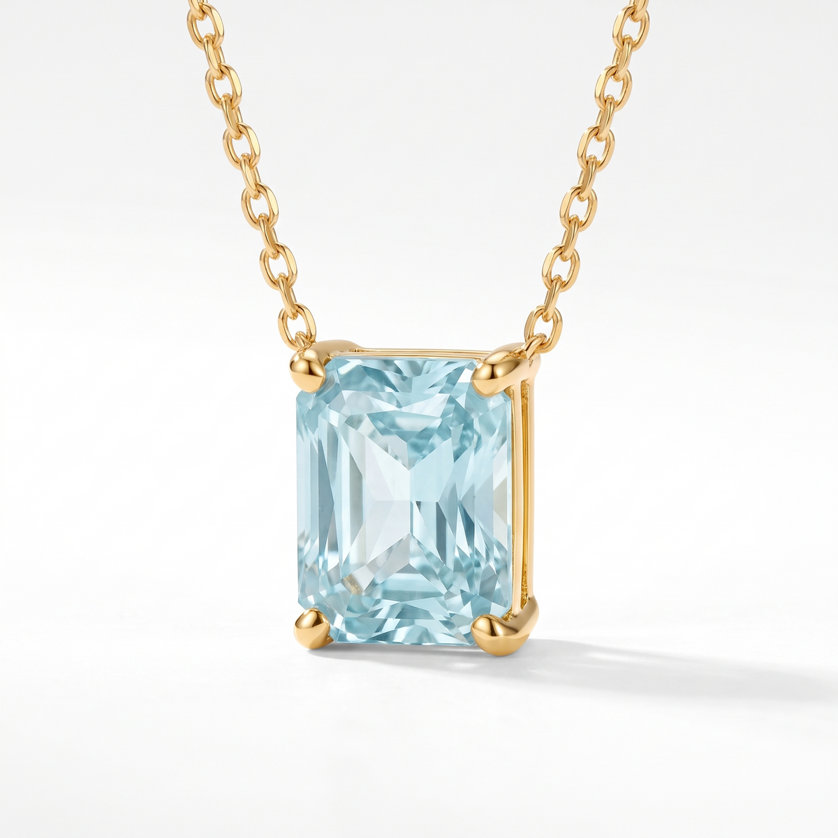 Radiant-cut aquamarine solitaire necklace, angled front detail — AI-generated design representation