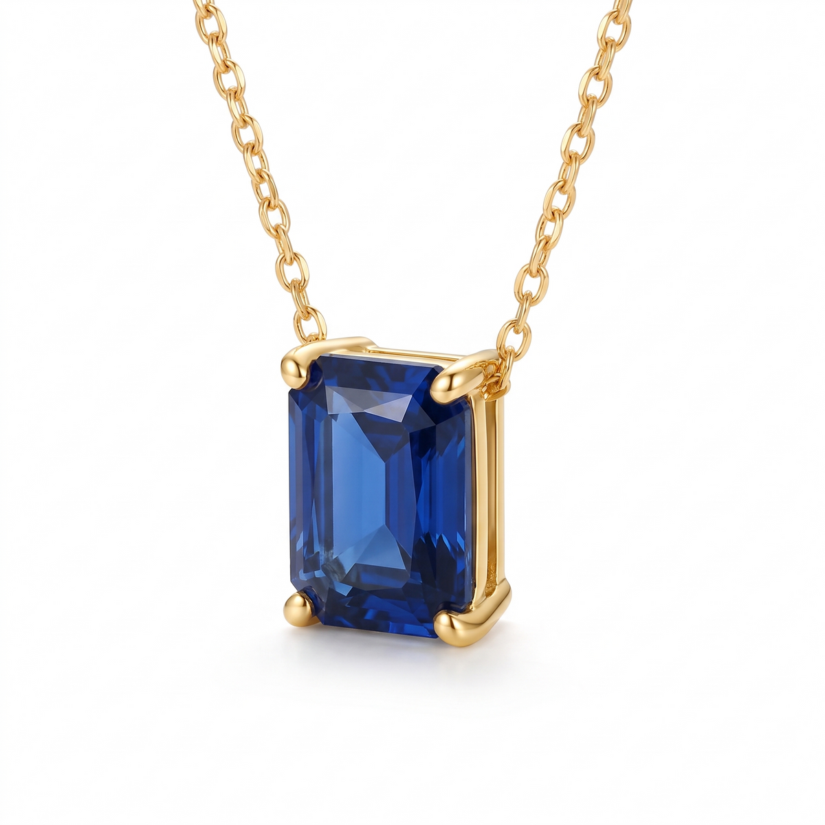 Radiant-cut blue sapphire solitaire necklace, angled front detail — AI-generated design representation