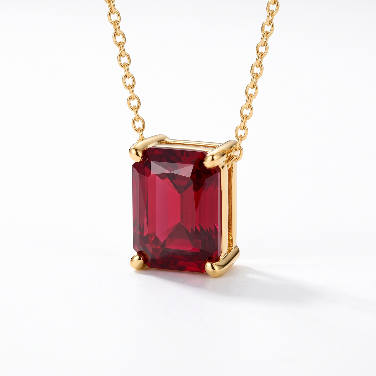 Radiant-cut ruby solitaire necklace, angled front detail — AI-generated design representation