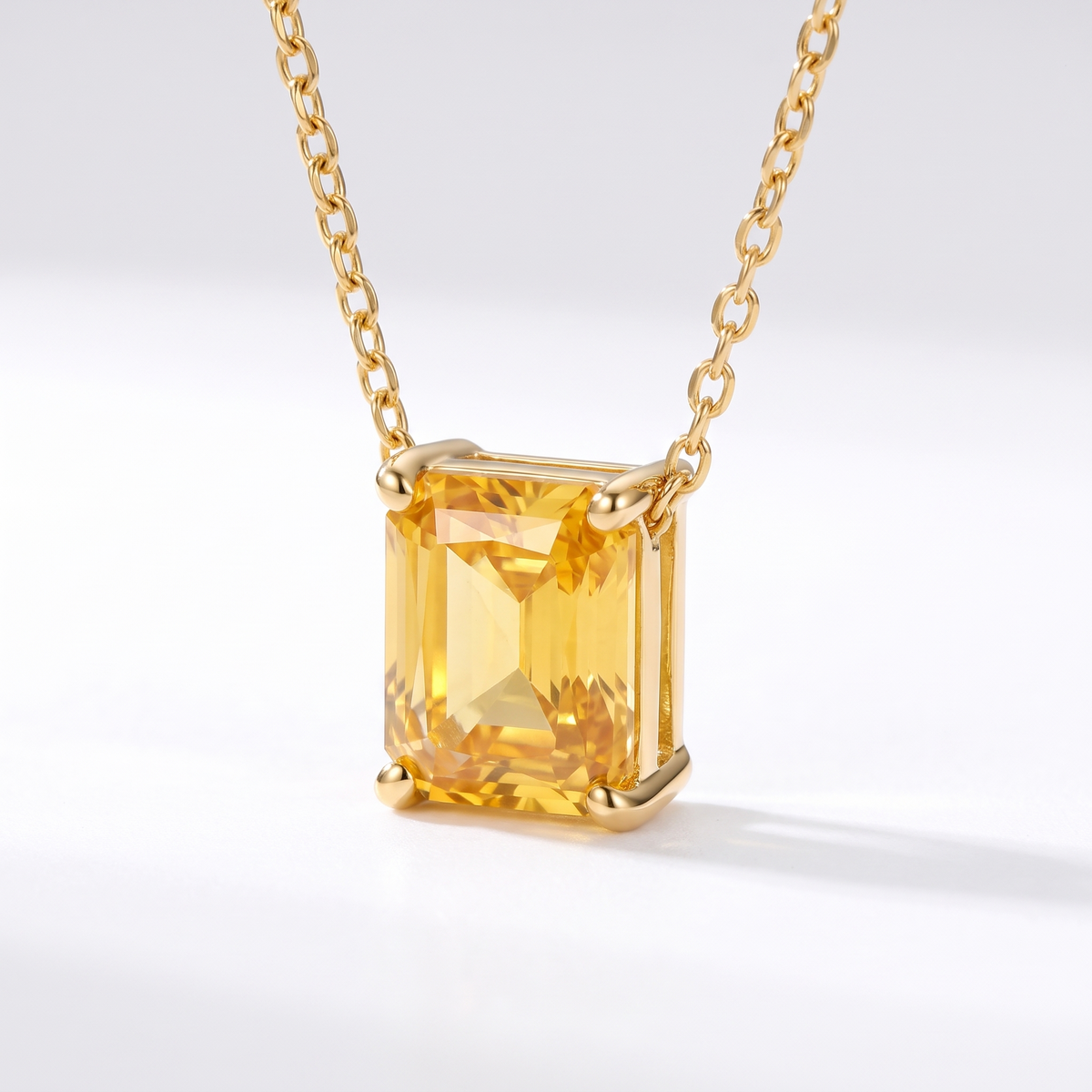 Radiant-cut yellow sapphire solitaire necklace, gemstone and setting detail — AI-generated design representation