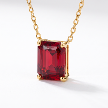 Radiant-cut ruby solitaire necklace, gemstone and setting detail — AI-generated design representation