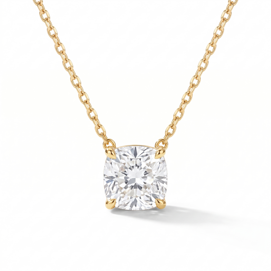 Cushion-cut diamond solitaire necklace in solid gold, catalog view — AI-generated design representation