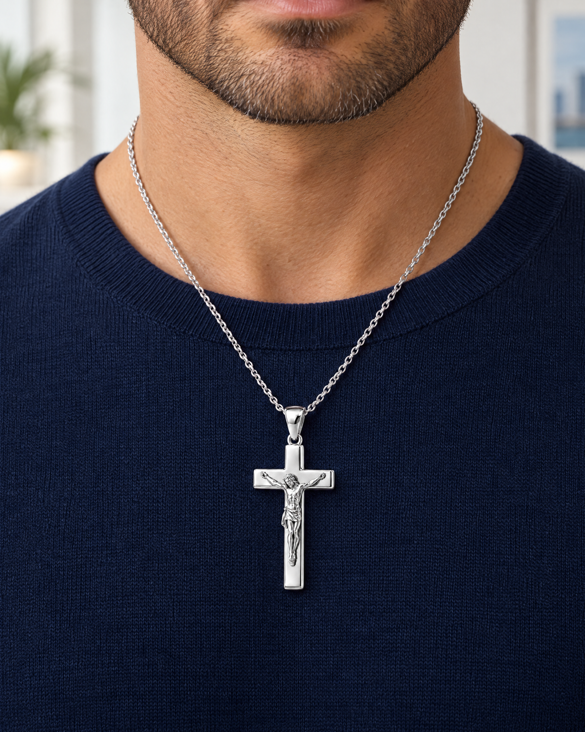 Crucifix sterling silver pendant on a model; AI lifestyle visualization, size illustrative, styling chain not included.