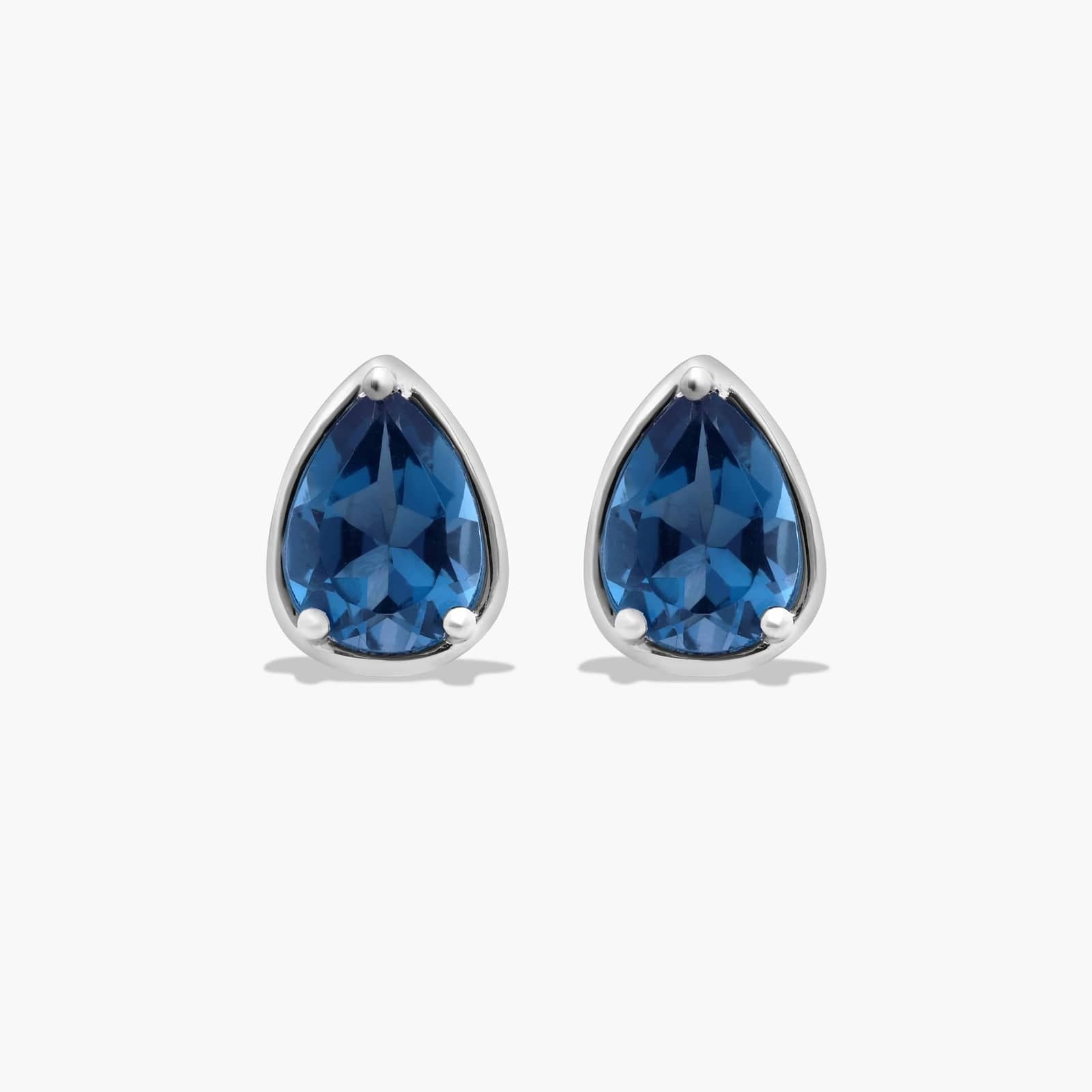 Radiant Reflections Pear Shape Blue Topaz Stud Earrings In 14K White Gold