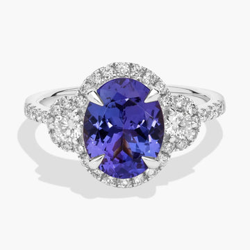 Oval Cut Tanzanite Diamond Side Stone Ring in 14k White Gold (10x8mm)
