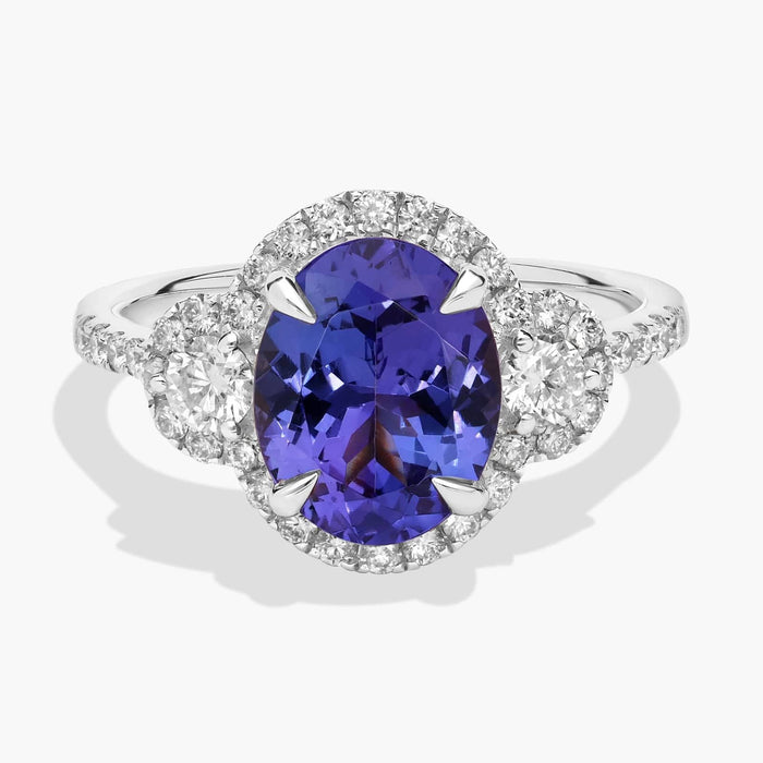 Oval Cut Tanzanite Diamond Side Stone Ring in 14k White Gold (10x8mm)