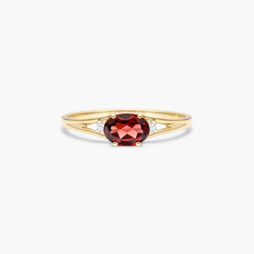 Oval Garnet And Diamond Accent Birthstone Ring In 14K Yellow Gold