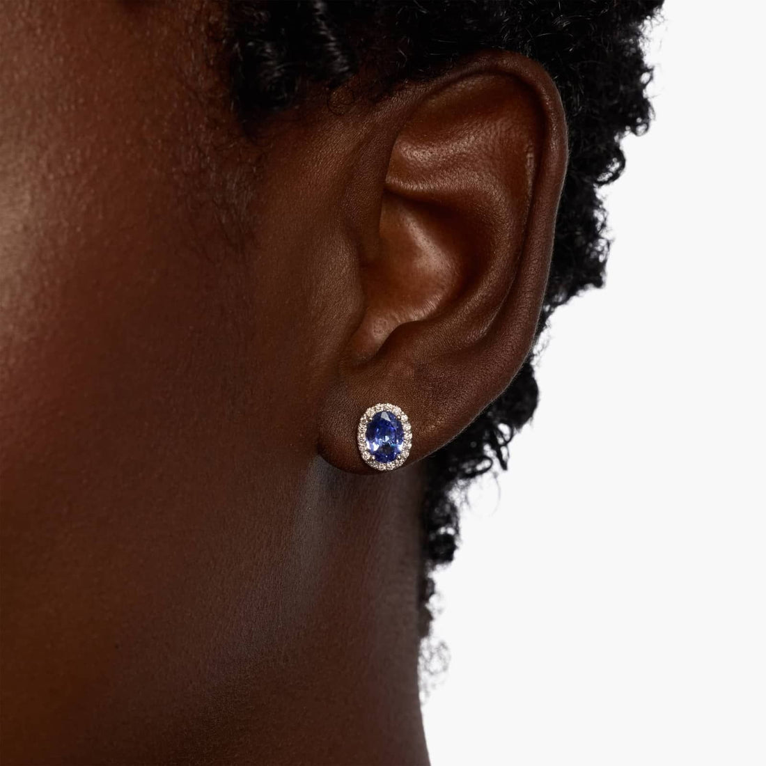 Oval Tanzanite and Diamond Halo Stud Earrings in 14k White Gold (5x7mm)