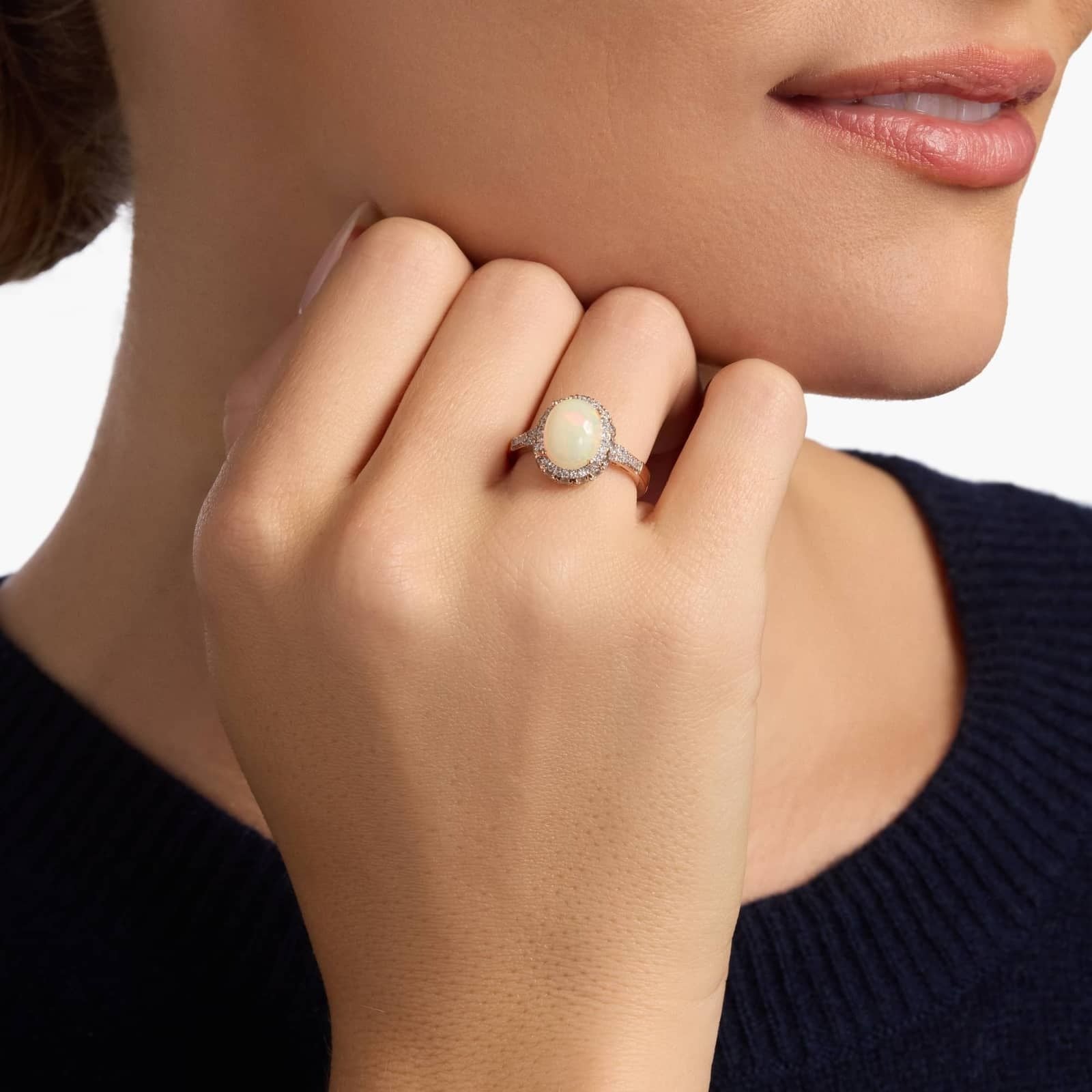 Oval Opal and Swiss Blue Topaz Halo Ring in 14k Rose Gold