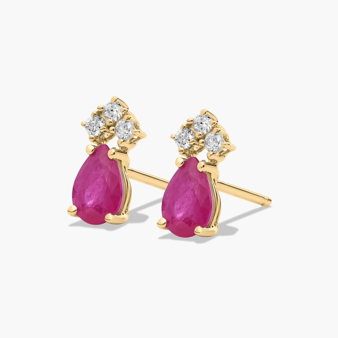 Pear Shape Ruby And Tri-Diamond Stud Earrings In 14K Yellow Gold