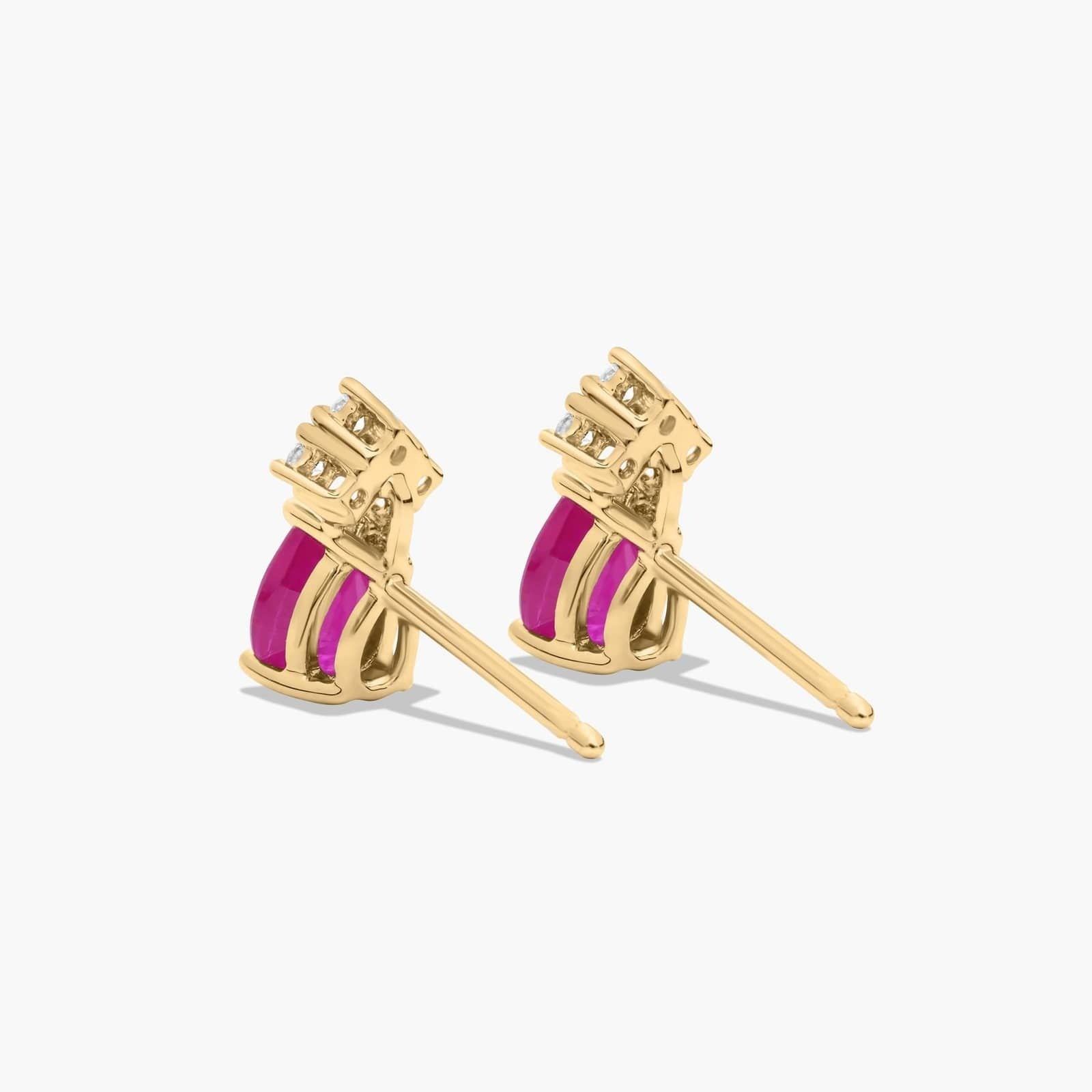 Pear Shape Ruby And Tri-Diamond Stud Earrings In 14K Yellow Gold