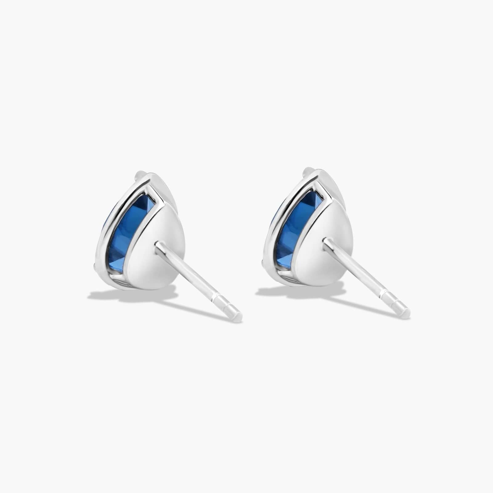 Radiant Reflections Pear Shape Blue Topaz Stud Earrings In 14K White Gold