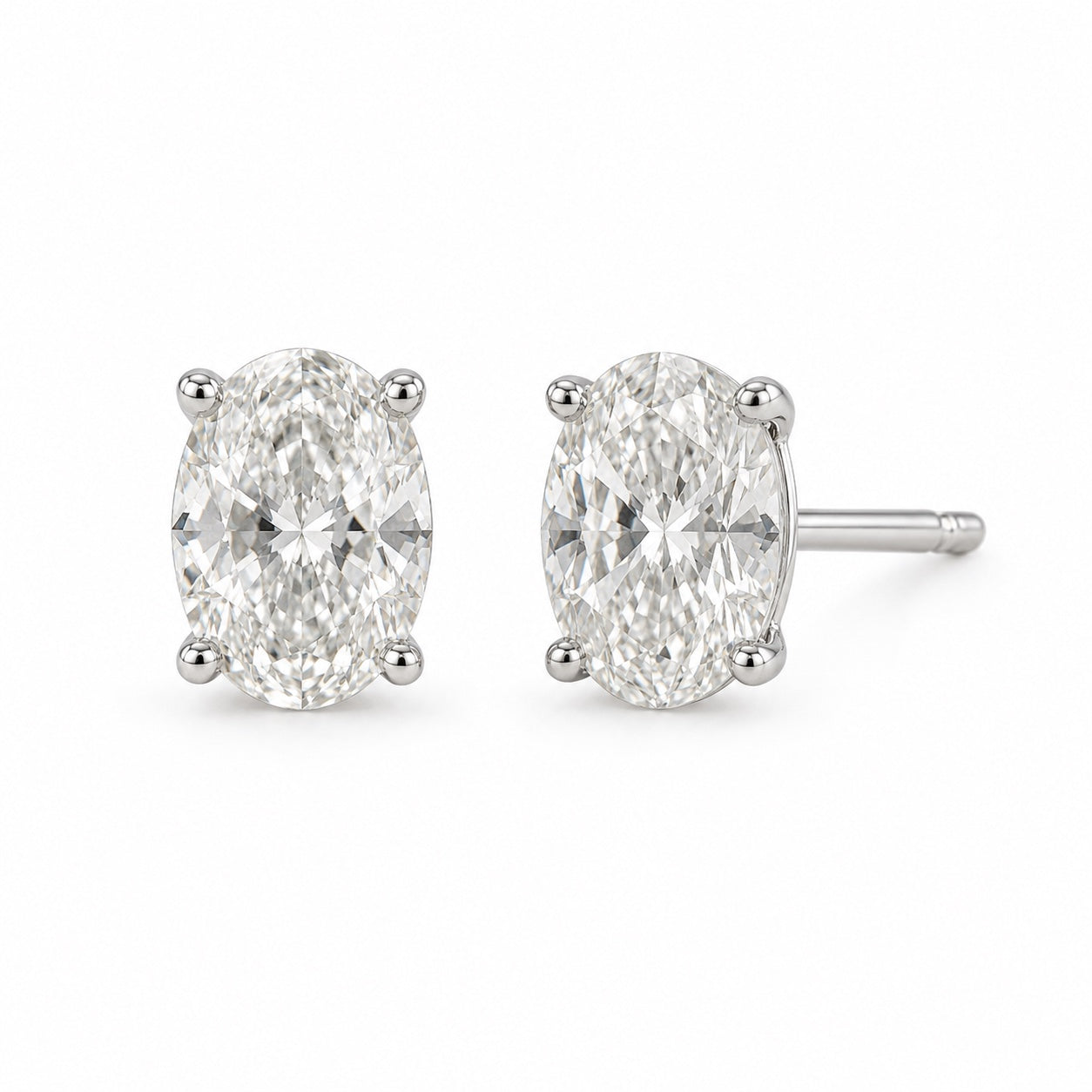 Oval 1.00 CTW lab-grown diamond stud earrings in 14K white gold, front and side views