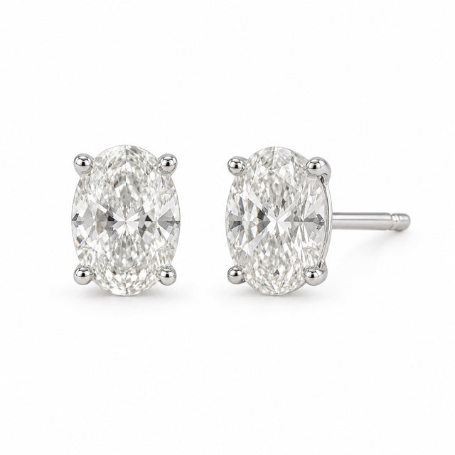 Oval 1.00 CTW lab-grown diamond stud earrings in 14K white gold, front and side views