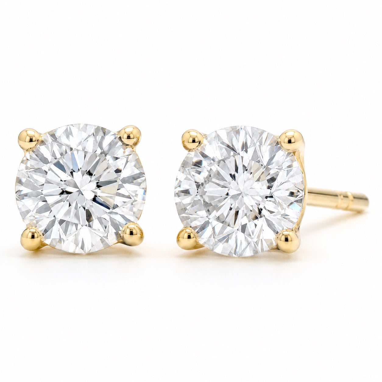 Round 1.50 CTW lab-grown diamond stud earrings in 14K yellow gold, front and side views